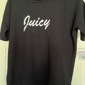 Cute black juicy t shirt with white trim on top of sleeves.